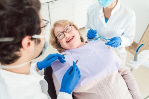 Person excited to experience the benefits of implant-retained dentures