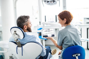 prosthodontist walking patient through removable partial dentures