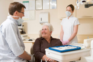 person visiting prosthodontist after dentist submitted professional referrals